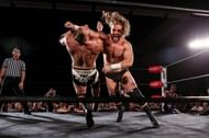 Adam Page's shotgun lariat takes down an unwary foe.